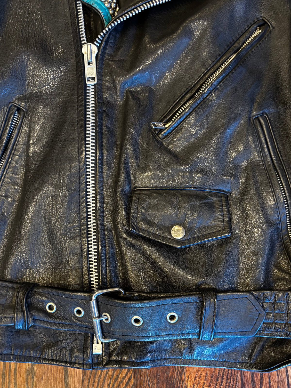 Wilson’s Leather Moto Jacket with Studded Turquoise Details ￼