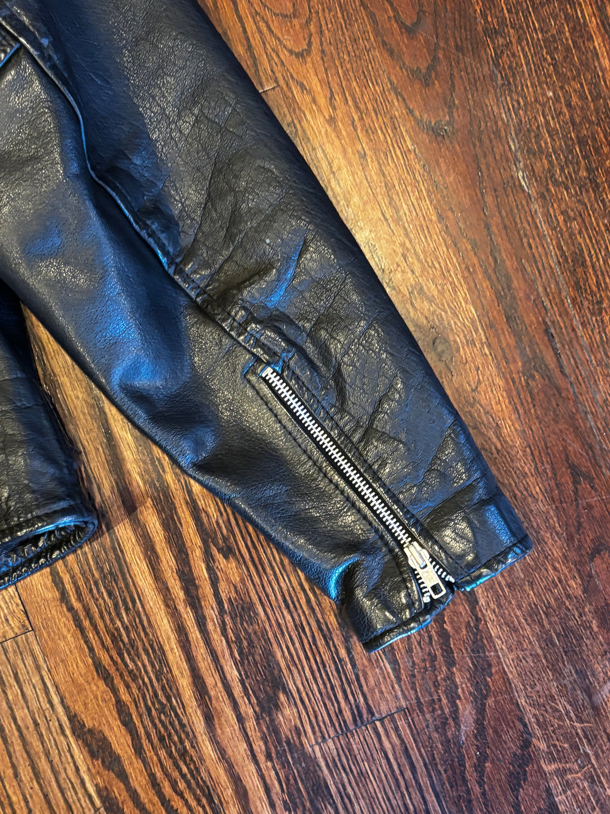 Wilson’s Leather Moto Jacket with Studded Turquoise Details ￼