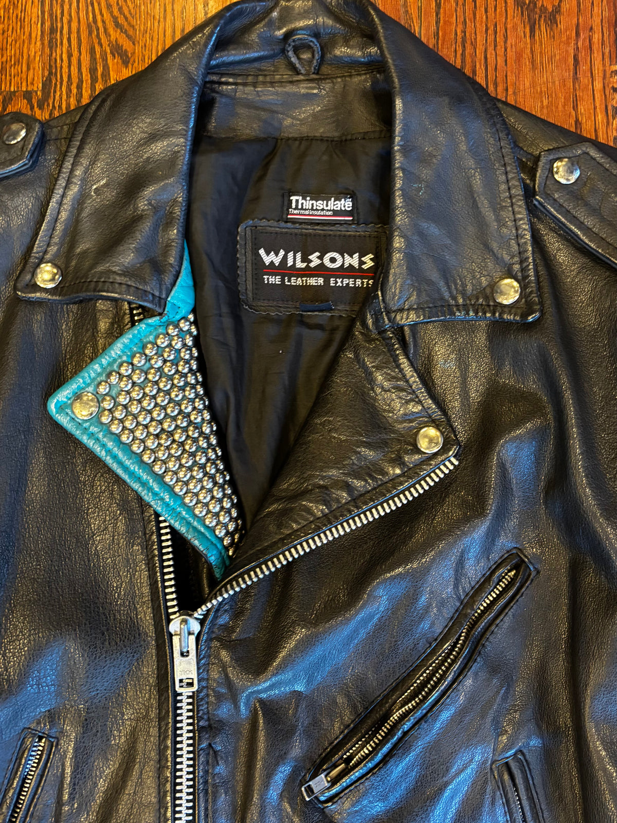 Wilson’s Leather Moto Jacket with Studded Turquoise Details ￼